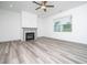 Elegant living room with hardwood floors, a ceiling fan, and a modern fireplace at 425 Sunny Field Dr., Wake Forest, NC 27587