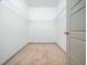 Spacious walk-in closet with ample shelving and neutral carpet at 425 Sunny Field Dr., Wake Forest, NC 27587