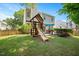 Large fenced backyard with a playset and room to play at 4524 Drewbridge Way, Raleigh, NC 27604