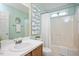 Charming bathroom with decorative accents, a soaking tub, and plenty of light at 4524 Drewbridge Way, Raleigh, NC 27604