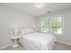 Bright bedroom with a window bringing in lots of light and neutral décor at 4524 Drewbridge Way, Raleigh, NC 27604