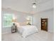 Comfortable bedroom with two windows, a ceiling fan and carpeted floors at 4524 Drewbridge Way, Raleigh, NC 27604