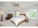 Spacious main bedroom features tray ceiling, fan, carpeted flooring, and two windows at 4524 Drewbridge Way, Raleigh, NC 27604