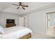 Spacious main bedroom with a view into the main bath featuring a soaking tub at 4524 Drewbridge Way, Raleigh, NC 27604
