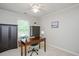 Cozy home office with desk, storage, and a ceiling fan for comfort at 4524 Drewbridge Way, Raleigh, NC 27604