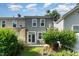 Backyard featuring a patio, grass, and the exterior of the home at 4732 Altha St, Raleigh, NC 27606