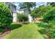 View of the backyard showcasing the greenery and the exterior of the home at 4732 Altha St, Raleigh, NC 27606