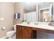 Bathroom featuring a single vanity with a dark wood cabinet and a toilet at 4732 Altha St, Raleigh, NC 27606