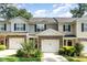 Charming townhome featuring a two-car garage, stone accents, and lovely landscaping at 4732 Altha St, Raleigh, NC 27606