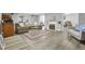 Finished basement with a cozy seating area, fireplace, and light wood-look flooring at 506 Tirzah Dr, Lillington, NC 27546