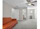 Bonus room with neutral carpet and walls, an attached bathroom and plenty of space at 506 Tirzah Dr, Lillington, NC 27546