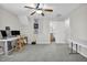 Spacious bonus room featuring neutral carpet, ceiling fan, and an attached bathroom at 506 Tirzah Dr, Lillington, NC 27546