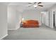 Bonus room featuring neutral walls, carpet, a ceiling fan, and a comfortable couch at 506 Tirzah Dr, Lillington, NC 27546