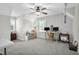 Large bonus room with two desks, ceiling fan, and windows letting in natural light at 506 Tirzah Dr, Lillington, NC 27546