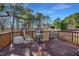 Outdoor seating area with a glass table and chairs to enjoy nature at 506 Tirzah Dr, Lillington, NC 27546