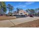 Charming home featuring manicured landscaping, an attached garage, and a long driveway at 506 Tirzah Dr, Lillington, NC 27546