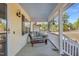 Welcoming covered porch with outdoor seating and stylish accents for relaxing and entertaining at 506 Tirzah Dr, Lillington, NC 27546