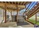 Backyard covered patio with a private hot tub, creating a spa-like experience at 506 Tirzah Dr, Lillington, NC 27546
