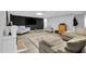 Finished basement living area features a TV, fireplace, and comfy sectional sofa at 506 Tirzah Dr, Lillington, NC 27546