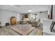 Finished basement living area features a fireplace, wet bar, and comfy sectional sofa at 506 Tirzah Dr, Lillington, NC 27546