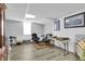 Finished basement sitting area with neutral walls and a large window at 506 Tirzah Dr, Lillington, NC 27546