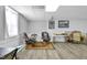 Finished basement sitting area with neutral walls and a large window at 506 Tirzah Dr, Lillington, NC 27546
