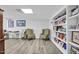 Finished basement features sitting area and built in shelves at 506 Tirzah Dr, Lillington, NC 27546