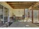 Relaxing covered patio featuring a table and chairs, perfect for outdoor entertaining at 506 Tirzah Dr, Lillington, NC 27546