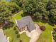 Aerial view of a beautiful home featuring lush trees, a spacious backyard, and a pool at 5125 Pinehall Wynd, Raleigh, NC 27604