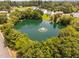 Overhead view of a pristine pond surrounded by lush greenery in a peaceful community at 5125 Pinehall Wynd, Raleigh, NC 27604