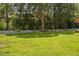 Expansive backyard enclosed with a classic white picket fence and mature trees at 5125 Pinehall Wynd, Raleigh, NC 27604