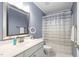 Bathroom featuring a single sink vanity, a large mirror, and a shower at 5125 Pinehall Wynd, Raleigh, NC 27604