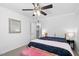 Cozy bedroom with a ceiling fan, carpeted floor, and an open door at 5125 Pinehall Wynd, Raleigh, NC 27604