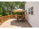 Outdoor deck with dining set perfect for entertaining and a backyard view at 5125 Pinehall Wynd, Raleigh, NC 27604