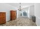 Bright dining area with tiled floors, a chandelier, and ample natural light at 5125 Pinehall Wynd, Raleigh, NC 27604