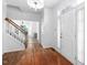 Inviting foyer with hardwood floors and staircase, leading to the main living spaces at 5125 Pinehall Wynd, Raleigh, NC 27604