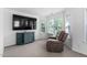 Cozy sitting area with a recliner and a view of the trees outside at 5125 Pinehall Wynd, Raleigh, NC 27604
