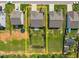 Home with estimated property lines shown. Spacious yard, landscaping, and backyard patio visible at 515 Legacy Dr, Youngsville, NC 27596