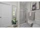 Neutral bathroom with a glass shower and framed mirror at 515 Legacy Dr, Youngsville, NC 27596