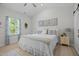 Comfortable bedroom with serene decor, natural light, and ample space at 515 Legacy Dr, Youngsville, NC 27596