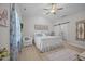 Cozy bedroom featuring a ceiling fan and private entry to the bathroom at 515 Legacy Dr, Youngsville, NC 27596