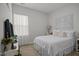 Cozy bedroom with soft lighting, a comfortable bed, and elegant decorative wall panels at 515 Legacy Dr, Youngsville, NC 27596