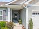 Inviting front entryway with a covered porch, stylish front door, and fresh landscaping at 515 Legacy Dr, Youngsville, NC 27596