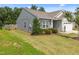 Well-maintained home featuring a manicured lawn, neat landscaping, and a cozy residential setting at 515 Legacy Dr, Youngsville, NC 27596