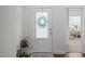 Entryway featuring a decorative front door with a frosted window and stylish seasonal decorations at 515 Legacy Dr, Youngsville, NC 27596