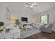 Bright living room featuring a fireplace, comfortable seating, and elegant decor for a welcoming atmosphere at 515 Legacy Dr, Youngsville, NC 27596