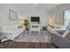 Bright living room featuring a fireplace, comfortable seating, and elegant decor for a welcoming atmosphere at 515 Legacy Dr, Youngsville, NC 27596