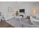 Bright living room featuring a fireplace, comfortable seating, and elegant decor for a welcoming atmosphere at 515 Legacy Dr, Youngsville, NC 27596