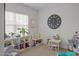 Bright playroom features a large window, organized shelving, and a variety of toys for creative play at 515 Legacy Dr, Youngsville, NC 27596