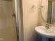 Bathroom featuring glass shower and pedestal sink at 5908 Abbington Way, Raleigh, NC 27610